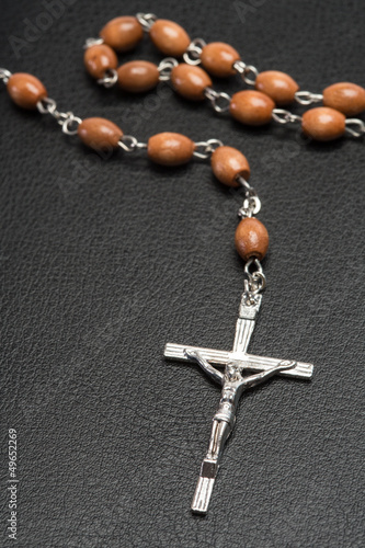 Photo: Rosary beads resting on a bible Rosary beads resting on a bible