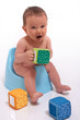 baby boy sitting on potty