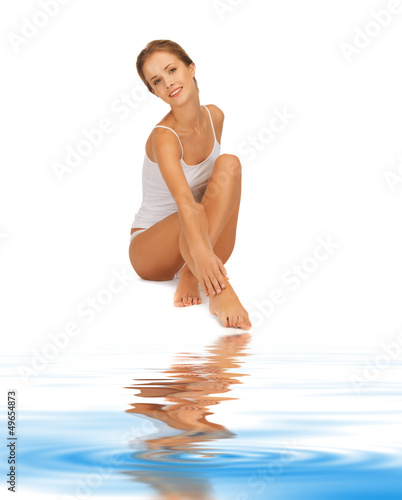Photo: woman in cotton undrewear touching her legs woman in cotton undrewear touching her legs