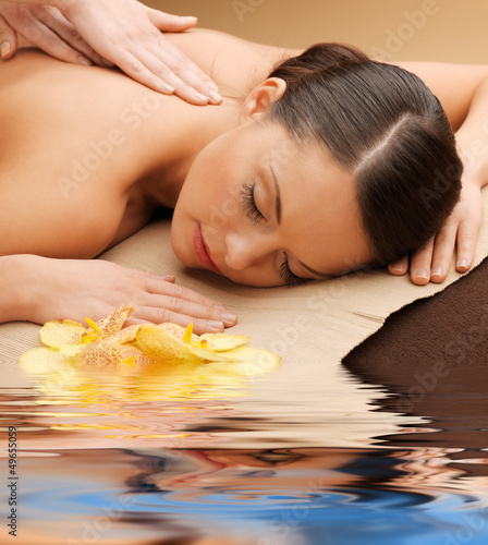 Photo: beautiful woman in massage salon beautiful woman in massage salon