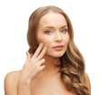 beautiful woman pointing to cheek