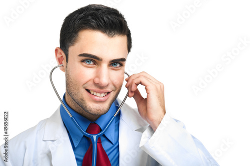 Photo: Young doctor isolated on white Young doctor isolated on white