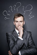 businessman with question marks