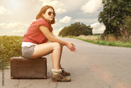 Photo: Young girl on the empty highway Young girl on the empty highway