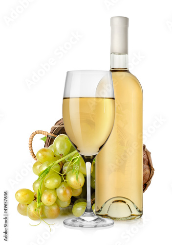 Photo: White wine bottle and grapes in basket White wine bottle and grapes in basket