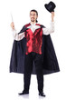 Magician with his magic wand on white