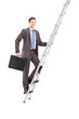 Full length portrait of a businessman climbing a ladder