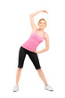 Full length portrait of a young female exercising
