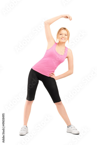 Photo: Full length portrait of a young female exercising Full length portrait of a young female exercising