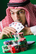 Arab playing in casino - gambling concept with man