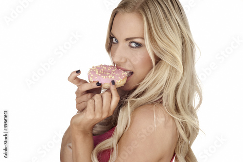 Photo: Woman eating a delicious cookie Woman eating a delicious cookie