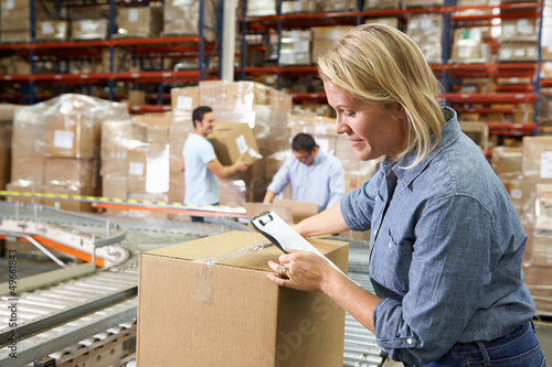 Photo: Workers In Distribution Warehouse Workers In Distribution Warehouse