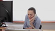 Young woman overhearing a phone conversation in the office