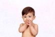 Adorable baby girl sucking her mouths