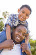 Photo: Mixed Race Father and Son Playing Piggyback Mixed Race Father and Son Playing Piggyback