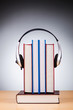 Concept of audio books with earphones on white