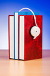 Concept of audio books with earphones on white