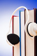 Concept of audio books with earphones on white