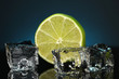 Ice cubes with lime on darck blue background