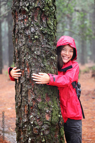 Photo: Happy girl tree hugger Happy girl tree hugger