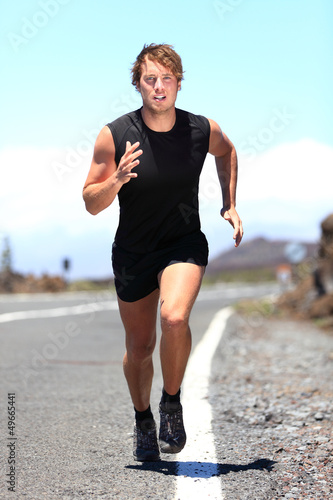 Photo: Man jogging on a country road Man jogging on a country road