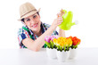 Girl watering plants on white