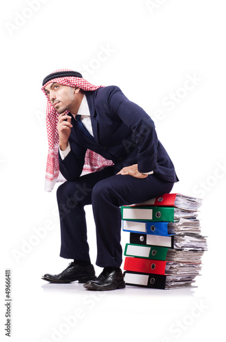 Photo: Arab businessman with many folders on white Arab businessman with many folders on white