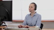 Attractive helpdesk consultant talking on headset
