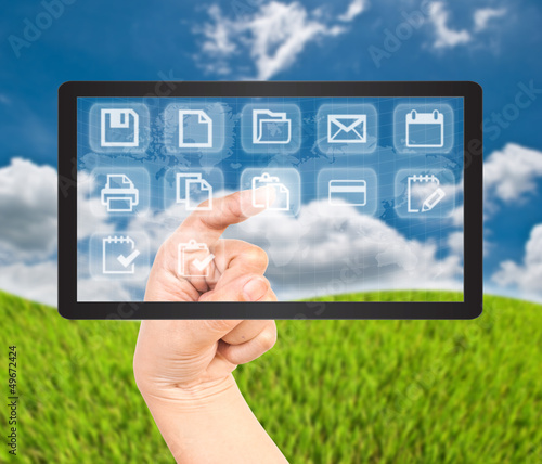 Photo: Hand pushing button on tablet screen. Hand pushing button on tablet screen.