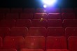 Empty comfortable red seats with numbers in cinema
