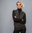 Elegant blond woman in casual brown clothes
