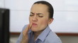 Woman with toothache, close up