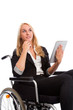 Photo: Blond girl sitting in a wheel chair with tablet PC Blond girl sitting in a wheel chair with tablet PC