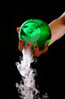 Hand in foggy with green jar