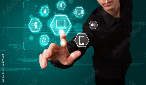 Photo: Businessman pressing virtual media type of buttons Businessman pressing virtual media type of buttons