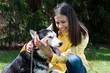 Photo: girl hugging her dog Siberian husky in yard girl hugging her dog Siberian husky in yard