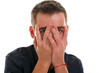 Young guy close face with hands