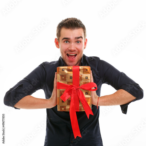 Photo: Young handsome guy with present Young handsome guy with present