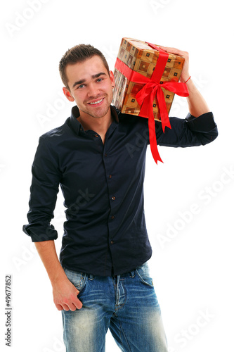 Photo: Young handsome guy with present Young handsome guy with present