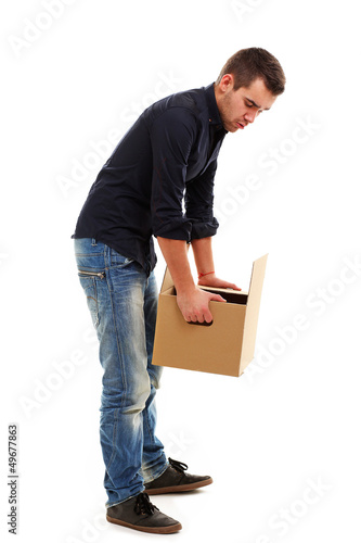 Photo: Young guy with cardboard box Young guy with cardboard box