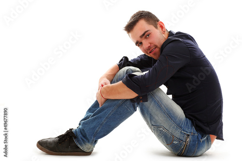 Photo: Young handsome guy sitting Young handsome guy sitting