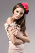 Photo: beautiful young brunette woman with flowers headband beautiful young brunette woman with flowers headband