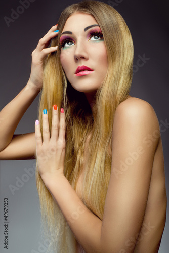 Photo: portrait of beautiful girl with healthy hair colorful nails portrait of beautiful girl with healthy hair colorful nails