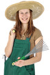 Junge Gärtnerin mit Gartenwerkzeugen