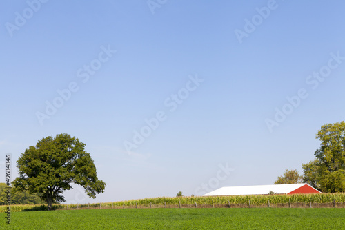 Photo: Traditional American Red Barn With Blue Sky Traditional American Red Barn With Blue Sky
