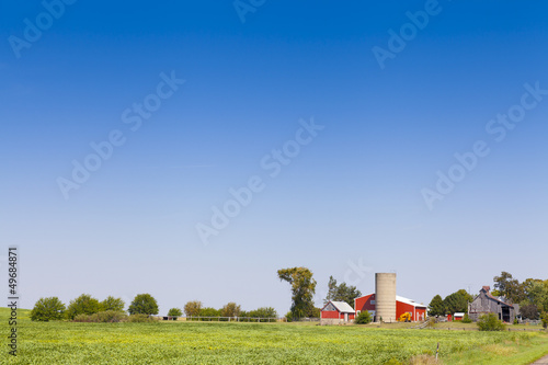 Photo: Traditional American Red Barn With Blue Sky Traditional American Red Barn With Blue Sky