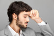 Portrait of a young business man looking depressed
