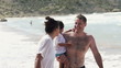 Laughing family on the beach, super slow motion