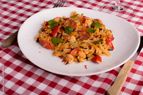 Photo: cajun jambalaya on white plate cajun jambalaya on white plate