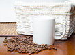 Photo: White cup and coffee beans White cup and coffee beans